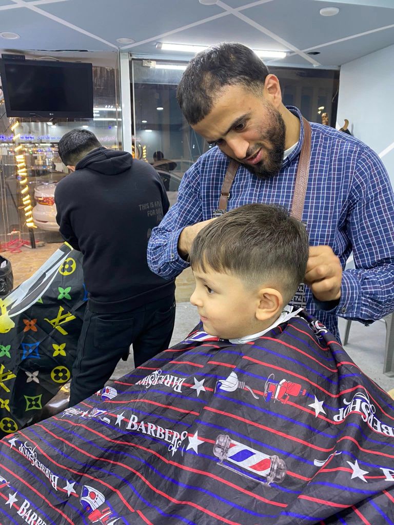 Barber with child